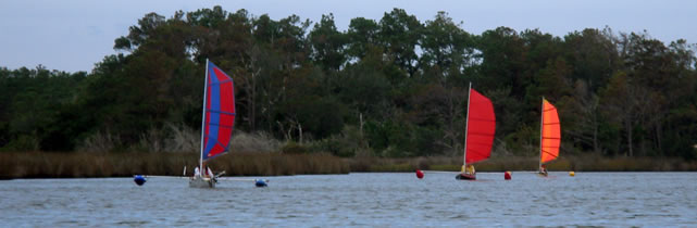 Group of sailing kayaks with BSD sails and outriggers
